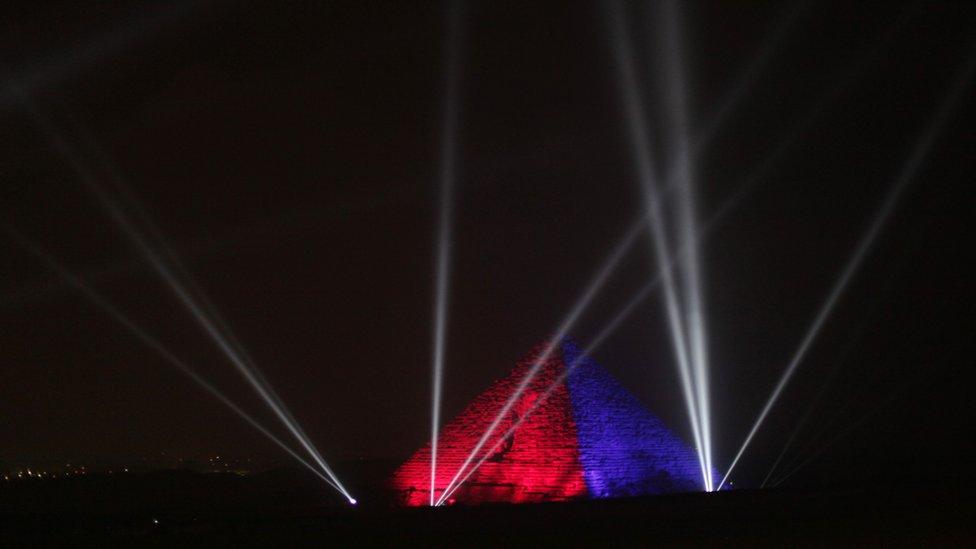 The Great Pyramids are illuminated for New Year's Eve in Giza, near Cairo