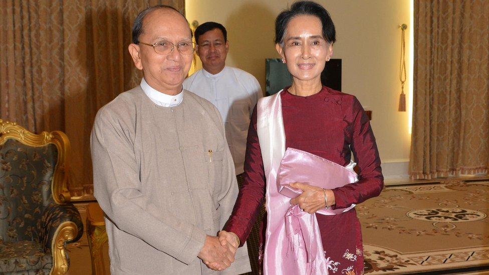 Myanmar President Thein Sein, left, shakes hands with opposition leader, Aung San Suu Kyi, during their meeting at the presidential residence on 2 December