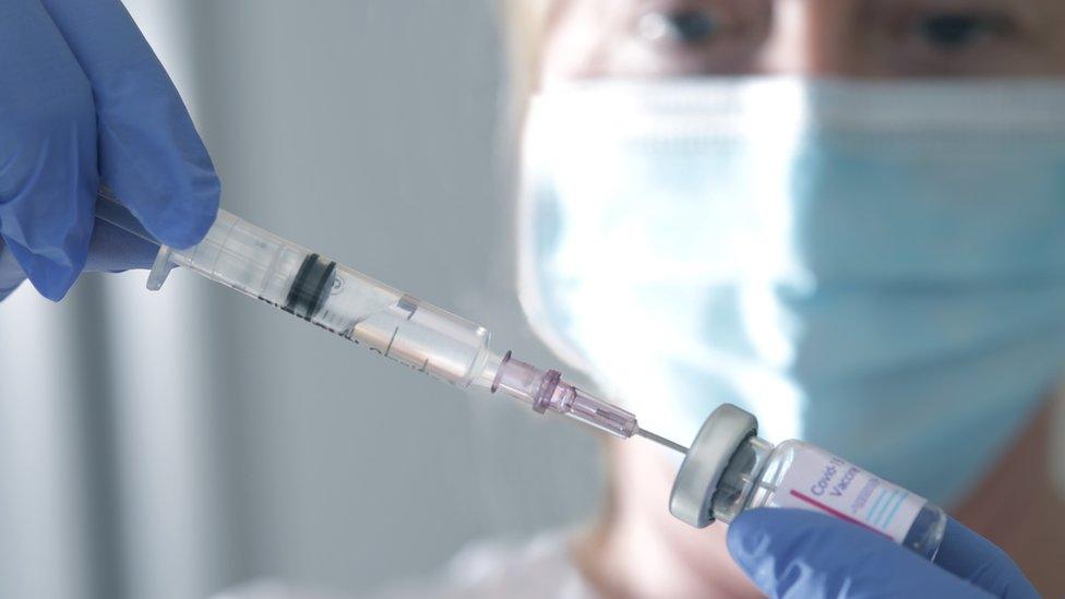 Nurse wearing a standard face mask