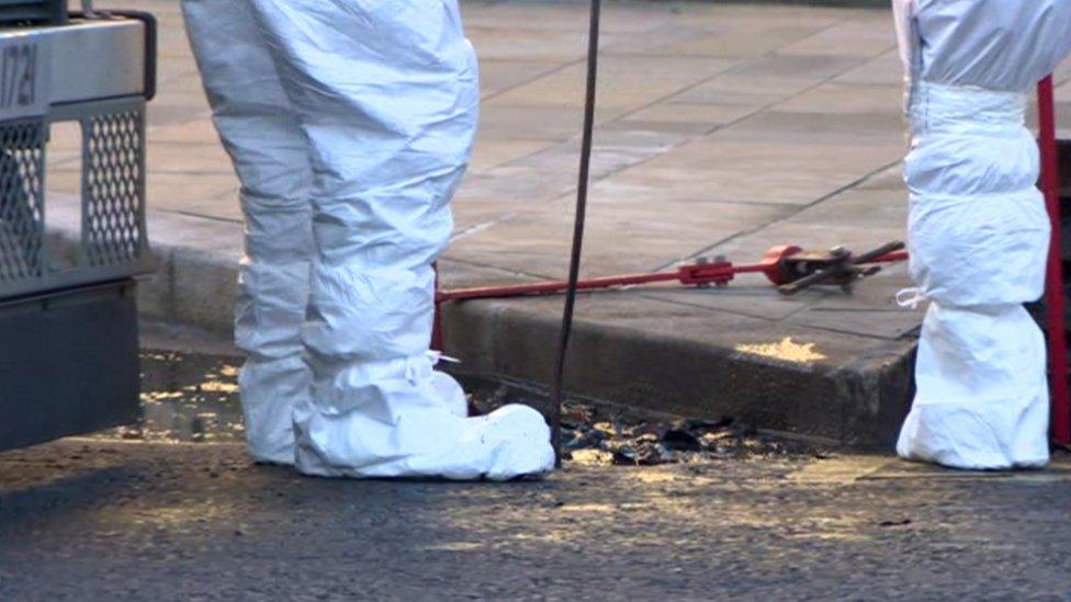 PSNI forensic officers examining the murder scene