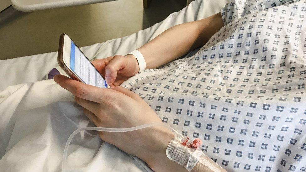 Patient texting from her hospital bed