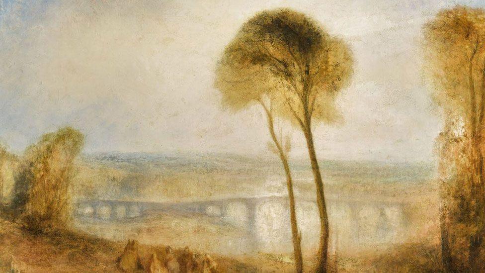 JMW Turner Landscape with Walton Bridges, mid 1840s, oil on canvas, showing a misty golden landscape with two trees in the foreground and to the side and a double-span bridge picked out in the middle distance and blue grey sky above 