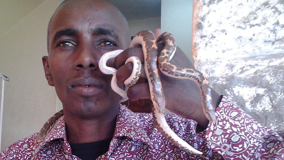 David Musyoka with a sand boa