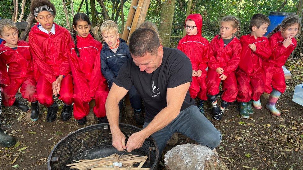 Steve Backshall lighting a fire