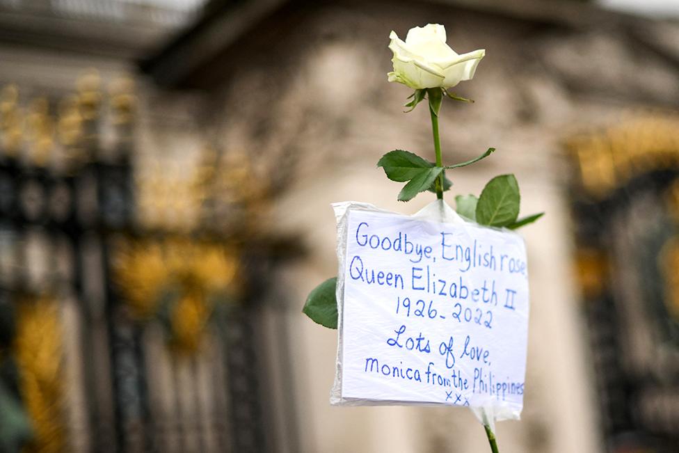 Flowers and tributes to Queen Elizabeth II are pictured outside of Buckingham Palace in London on 9 September 2022