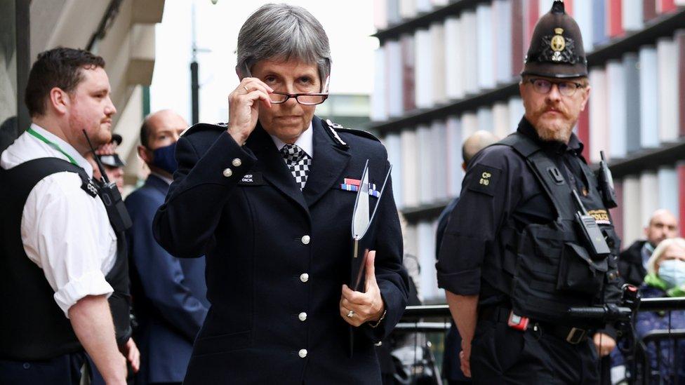 Metropolitan Police Commissioner Cressida Dick holds her glasses during the delivery of a statement outside the Old Baile