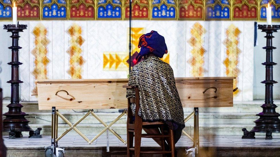 The daughter of the late Archbishop Emeritus Desmond Tutu sits quietly on her own during his state funeral in Cape Town, South Africa, January 1, 2022.