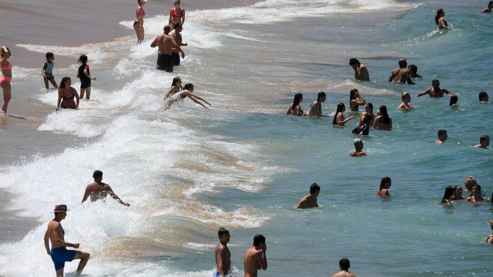 Swimmers are seen at Coogee Beach in Sydney, Australia, 31 January 2020.