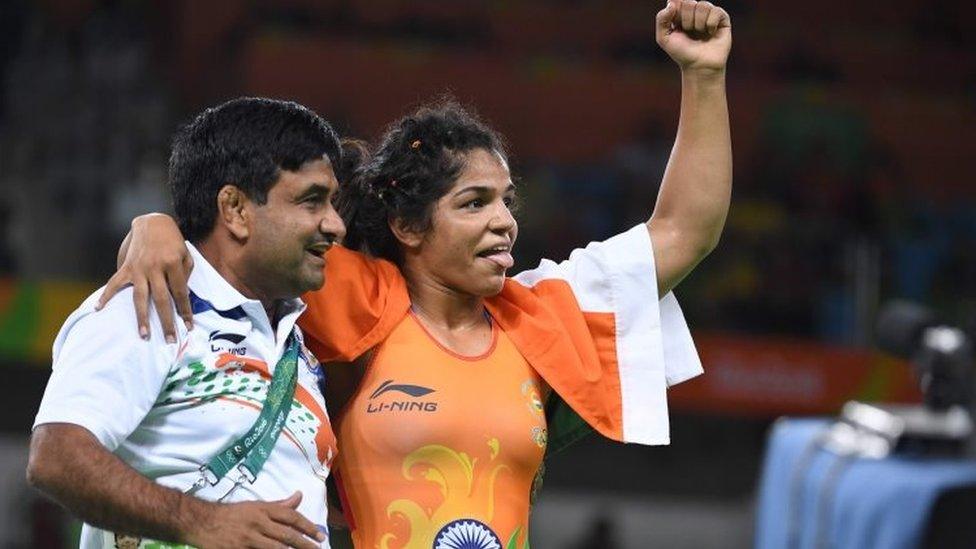 India"s Sakshi Malik celebrates after winning against Kirghyzstan"s Aisuluu Tynybekova in their women"s 58kg freestyle bronze medal match on August 17, 2016