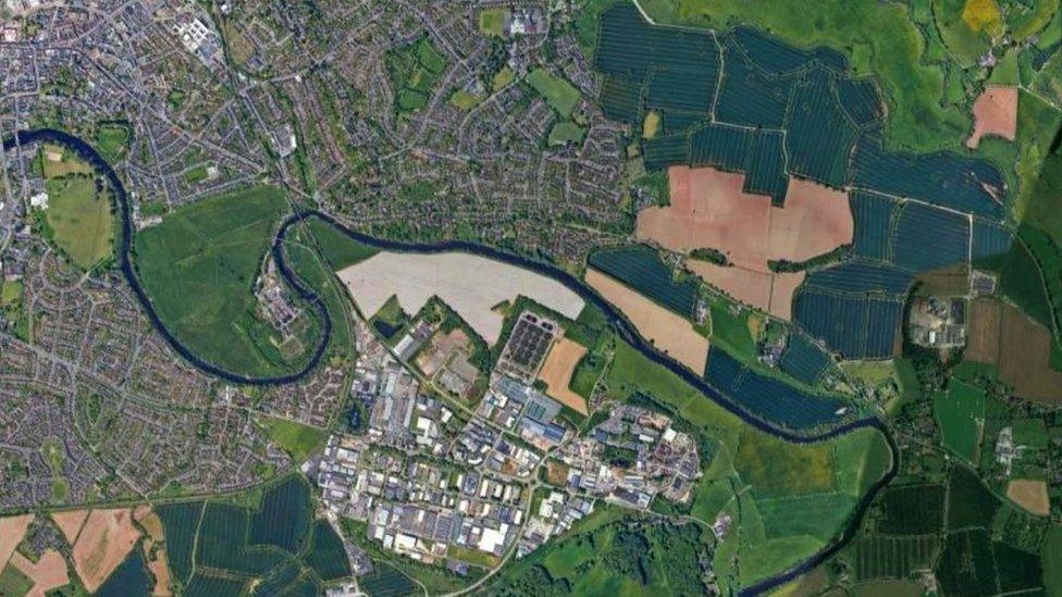 Aerial view of eastern Hereford, showing the A438 to the north of the river and Rotherwas industrial estate to the south (from Google)