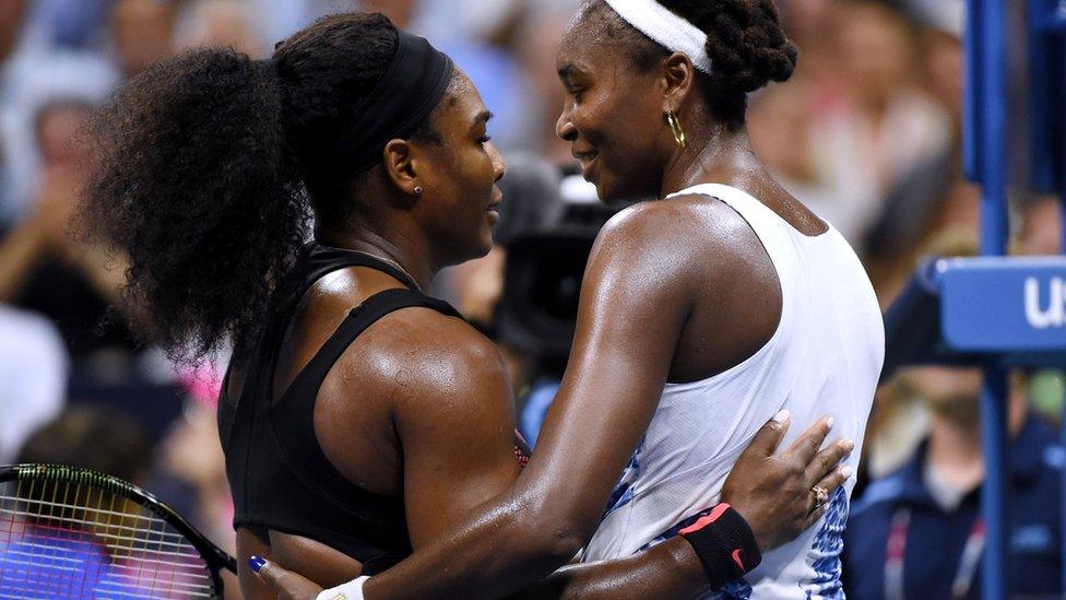 Serena Williams and sister Venus Williams hug at the US Open