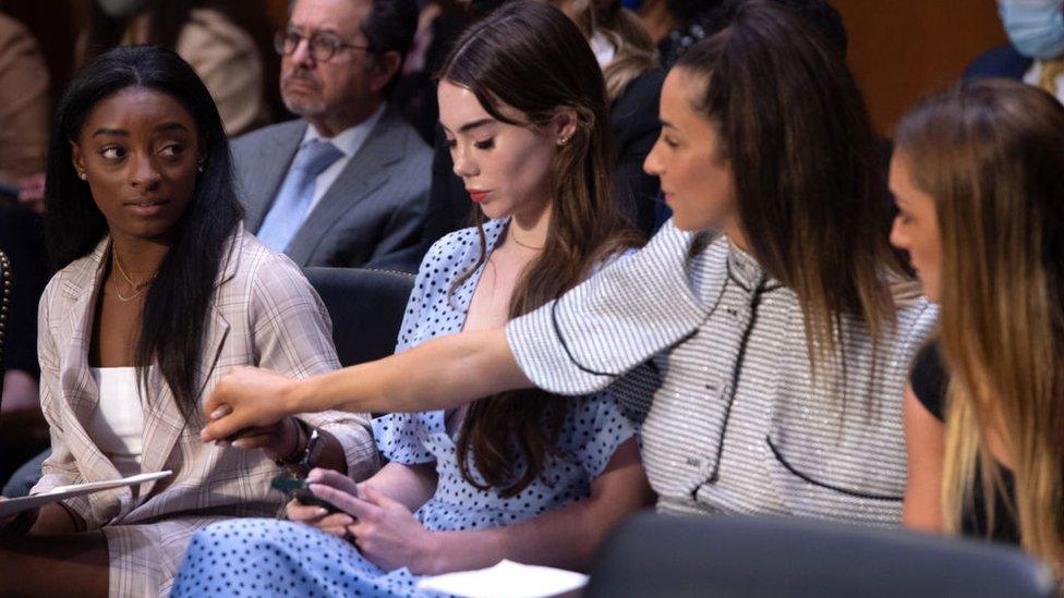 US gymnasts (L-R) Simone Biles, McKayla Maroney, Aly Raisman and Maggie Nichols arrive to testify during a Senate Judiciary hearing about the Inspector General's report on the FBI handling of the Larry Nassar investigation of sexual abuse of Olympic gymnasts, on Capitol Hill, September 15, 2021, in Washington, DC.