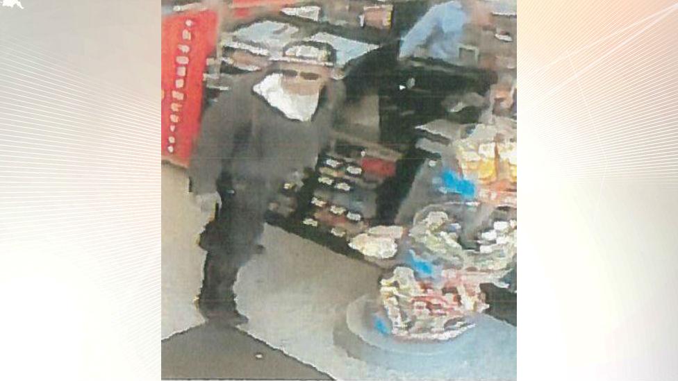 CCTV of man in baseball cap