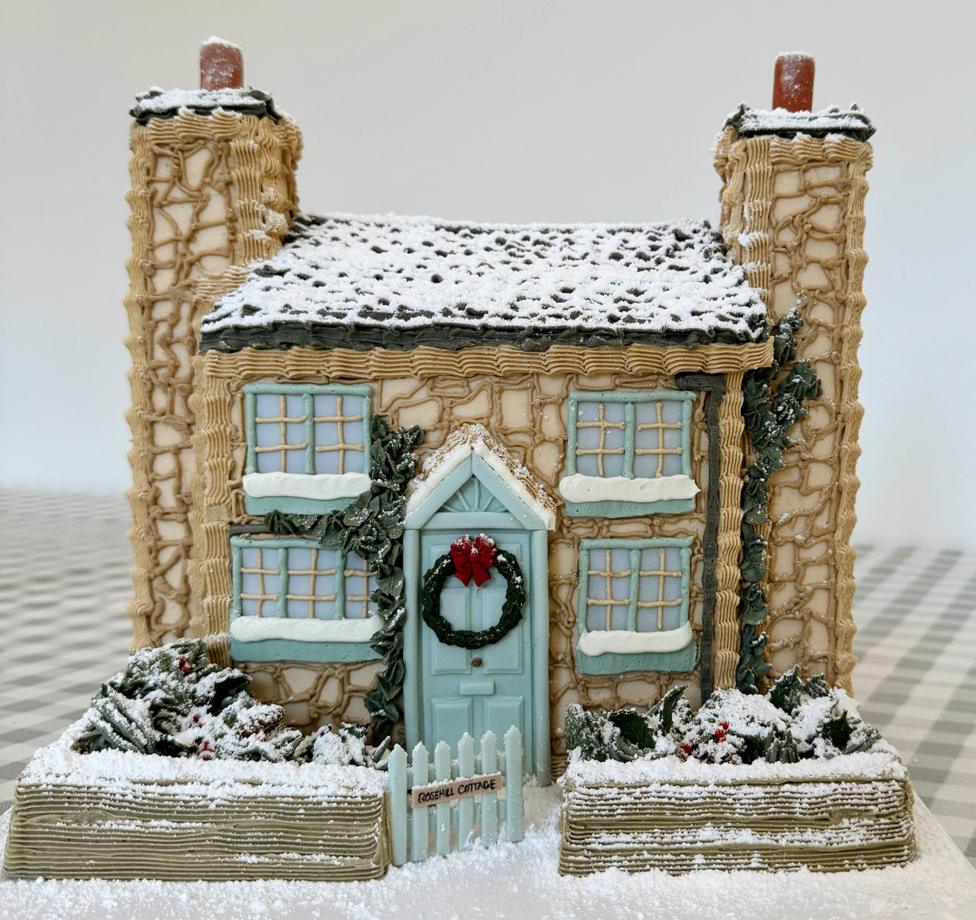 Photo of a cake made by Bridie West, the cake baker from Essex has gone viral on TikTok after making an "entirely edible" version of the cottage from the Christmas film The Holiday.