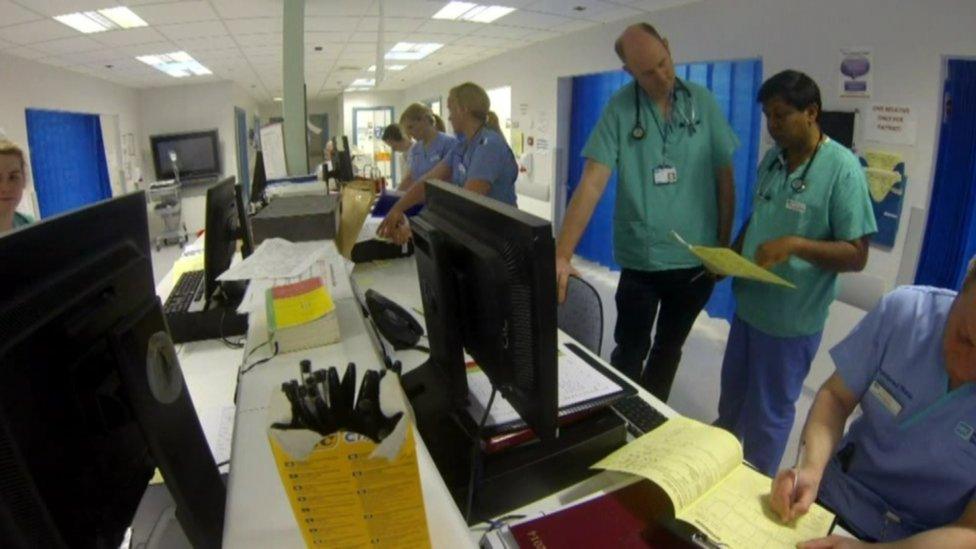 Doctors and consultants inside a hospital ward