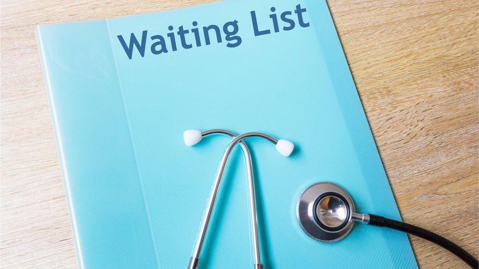 Hospital Waiting List Concept - with folder and stethoscope - stock photo