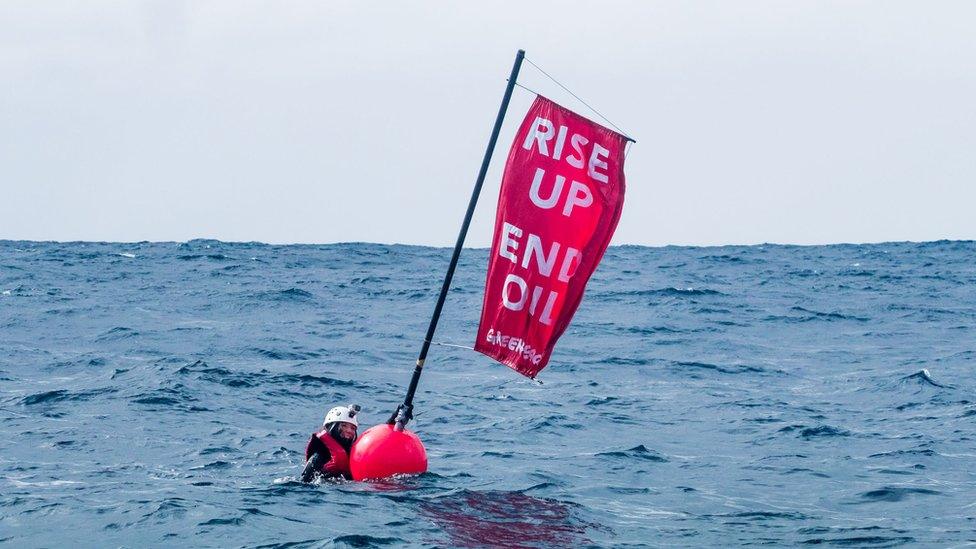 Sara in the water with a buoy