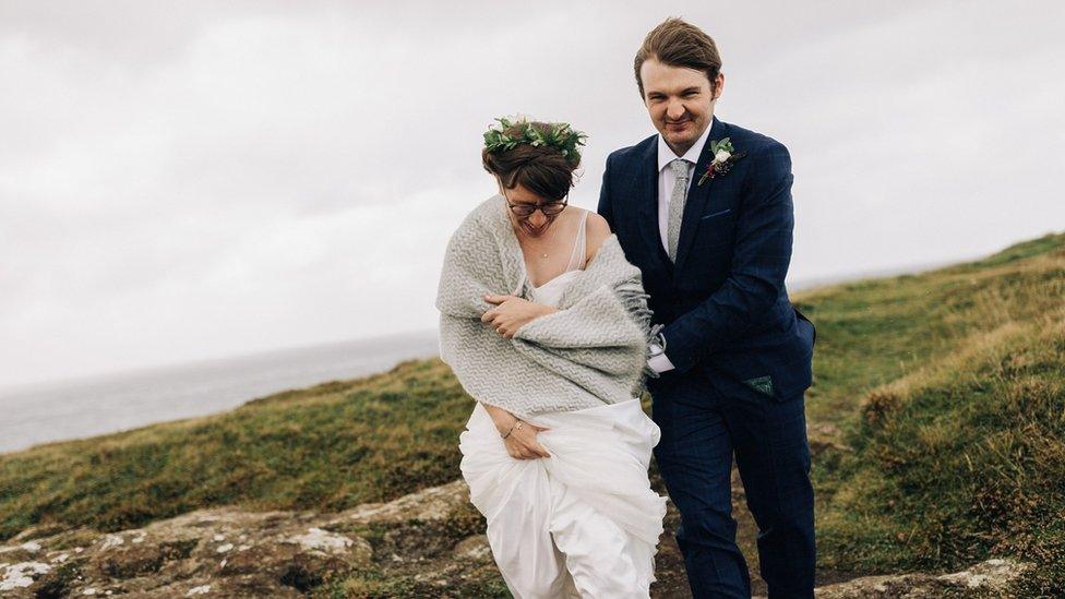 Thomas and Amber Hamilton braved the storm to get their wedding photographs