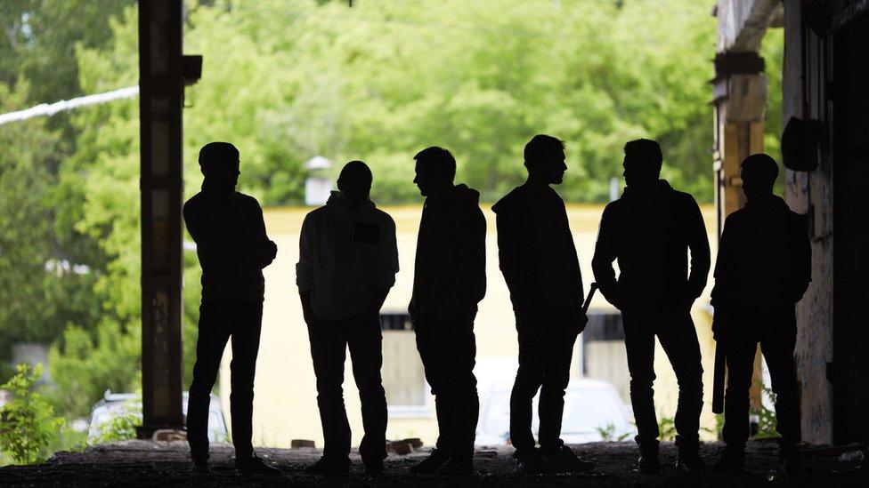 A gang in silhouette (library image)