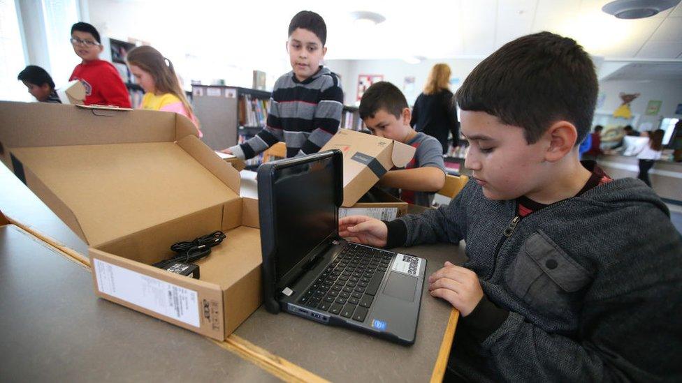 Pupils in California open new Chromebook laptop computers