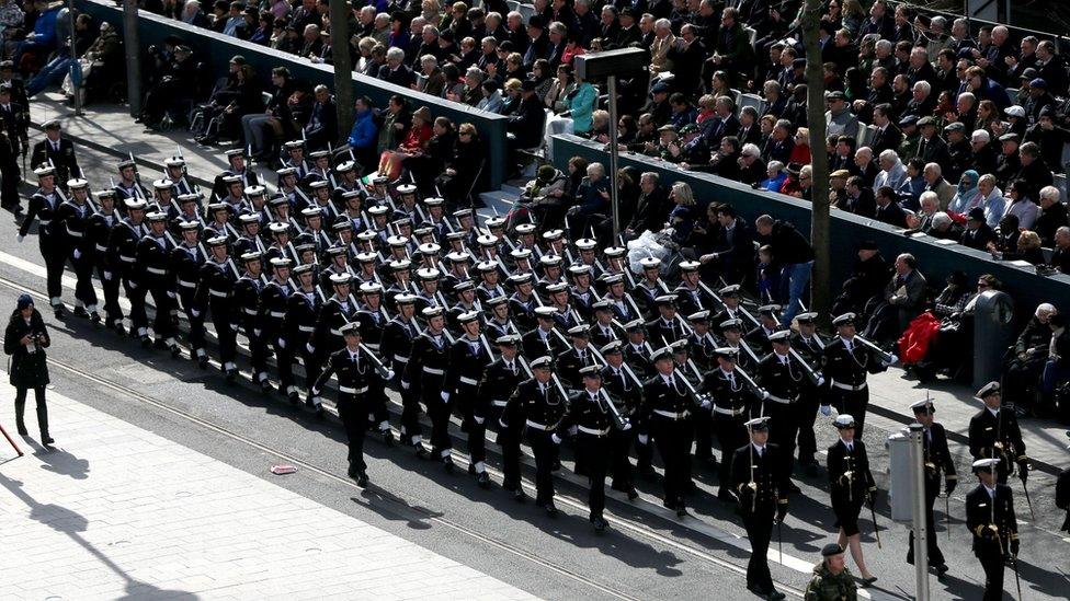 Members of the armed forces parade outside the General Post Office