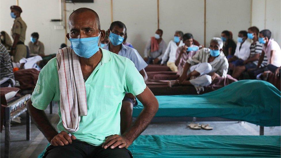 A homeless person waits to be vaccinated with a dose of Covishield Vaccine at the homeless shelter, Yamuna Pushta near Nigambodh Ghat cremation ground. India has reported 40 cases of Delta Plus variant also known as AY.1, found in Maharashtra, Kerala and Madhya Pradesh. This variant also been seen in nine other countries of the world with 205 infections detected in Europe, America and Asia. (Photo by Naveen Sharma/SOPA Images/LightRocket via Getty Images)