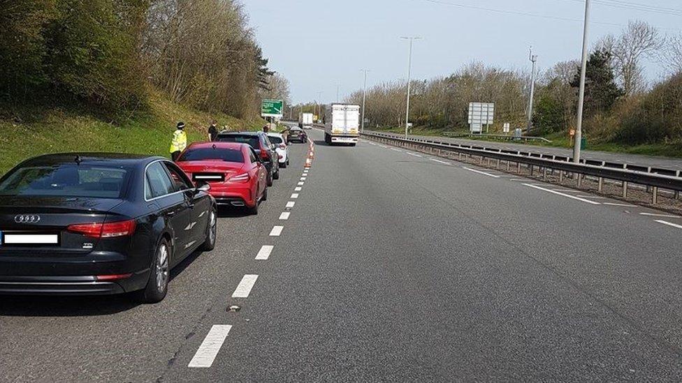 Police check on cars travelling across the Britannia Bridge