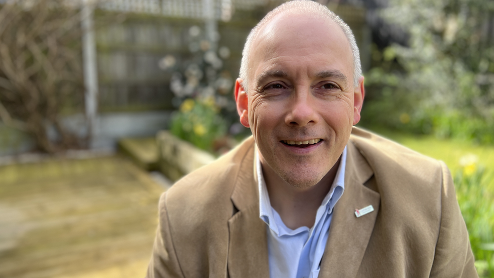 Robert Halfon sitting in his garden