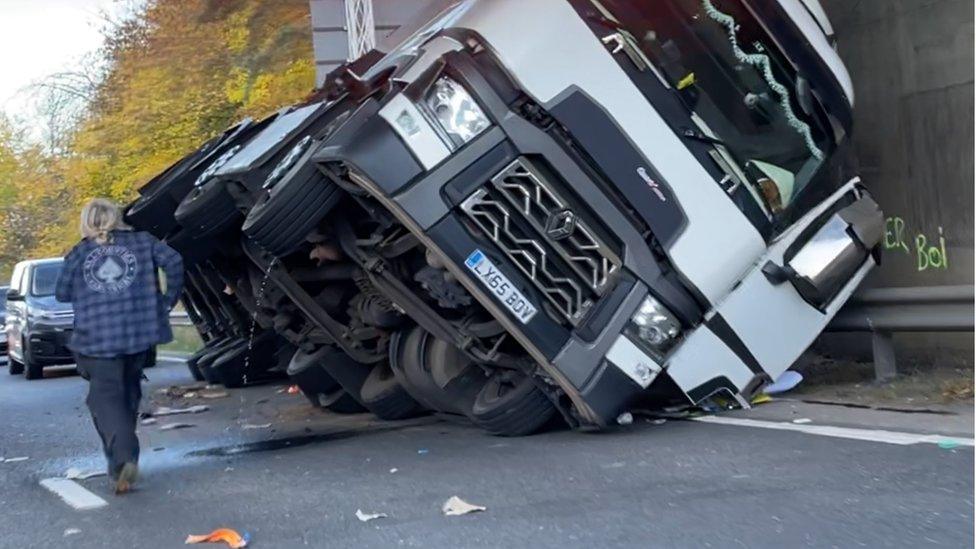The lorry that's crashed into the bridge