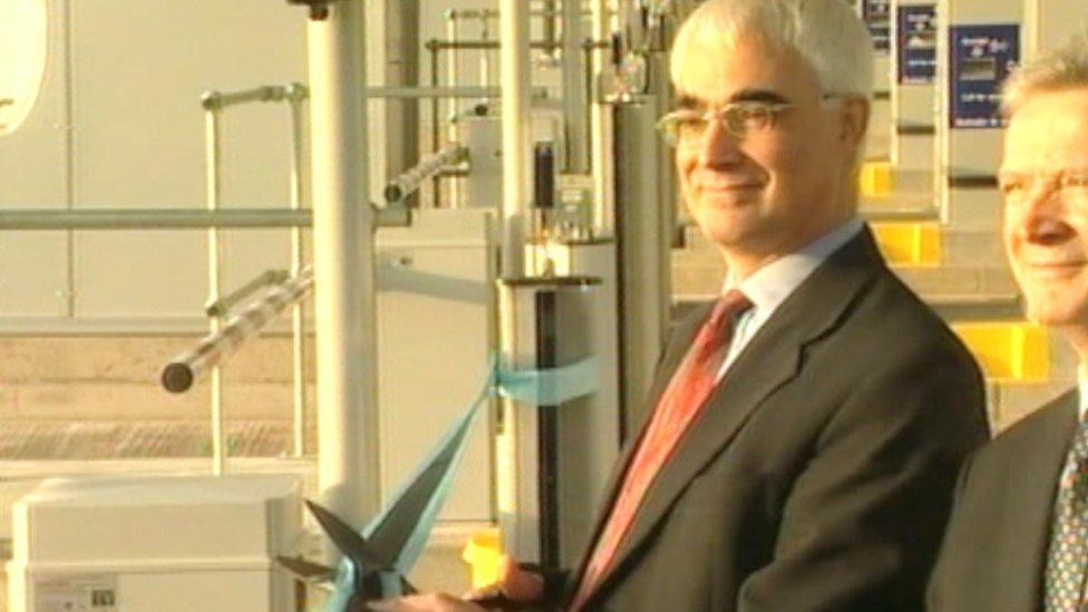 Darling cutting a ribbon