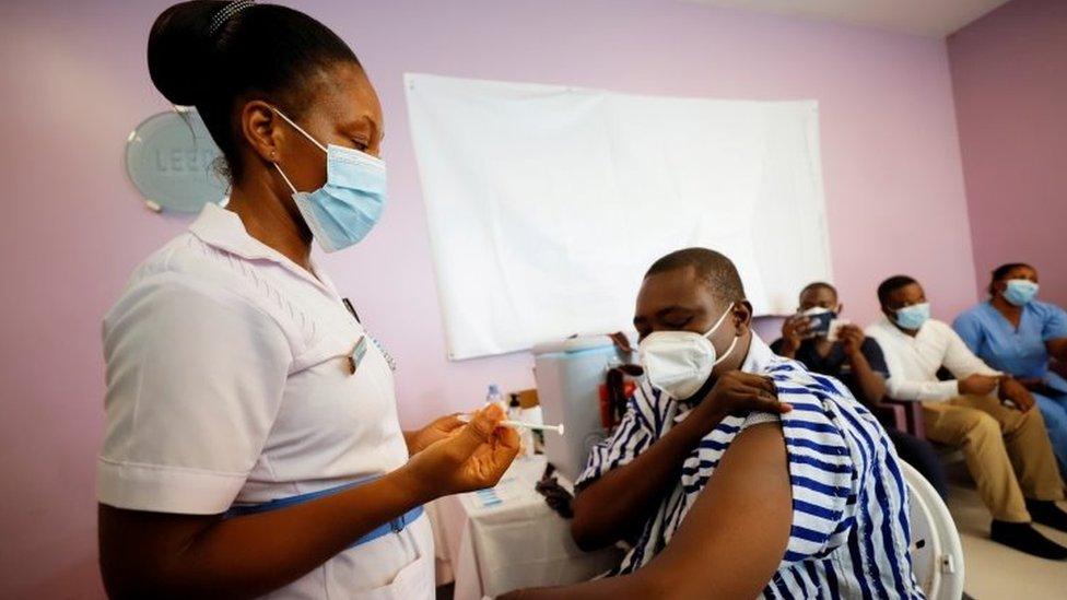 A woman is vaccinated in Accra, Ghana. Photo: March 2021