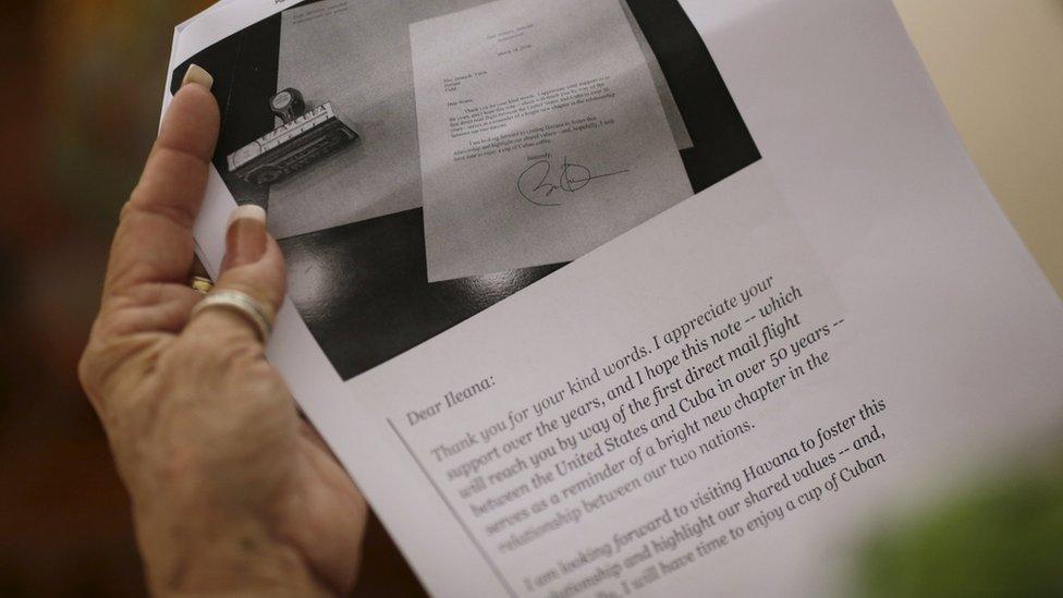 Ileana R. Yarza holds a print-out of a letter U.S. President Barack Obama is sending her via a flight carrying the first batch of U.S. direct mail to Cuba, after both countries agreed to restore direct postal service after a half-century rupture, at her home in Havana