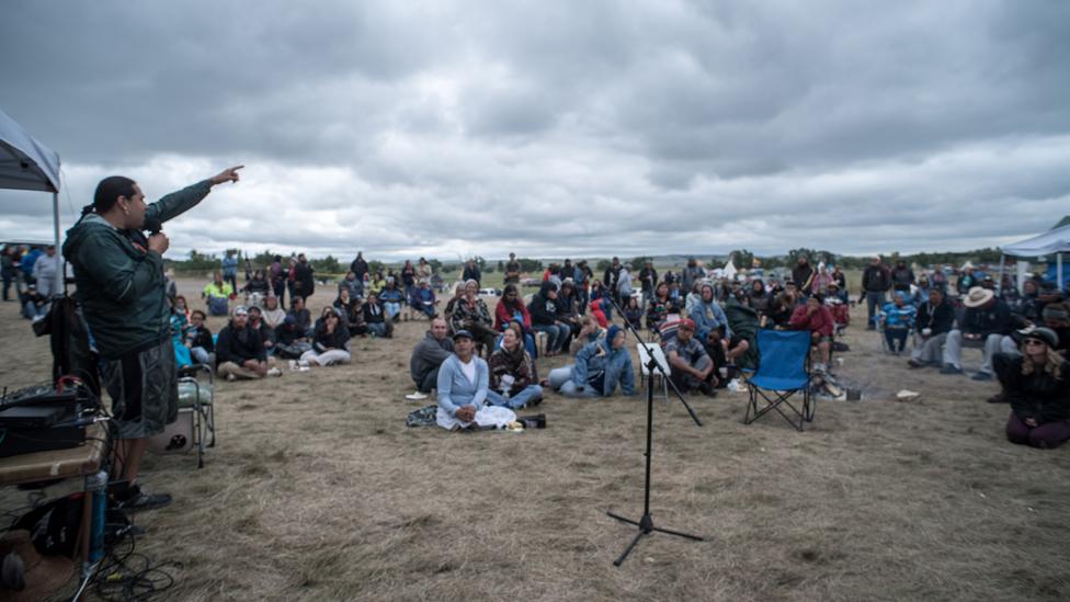 At the centre of the Red Warrior Camp is microphone, and at night, a blazing fire