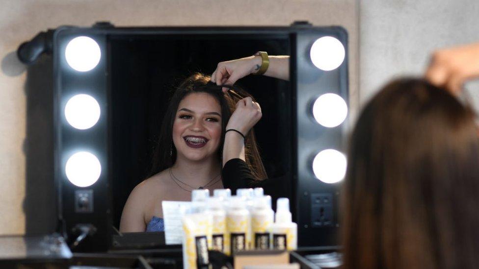 Girl having hair done