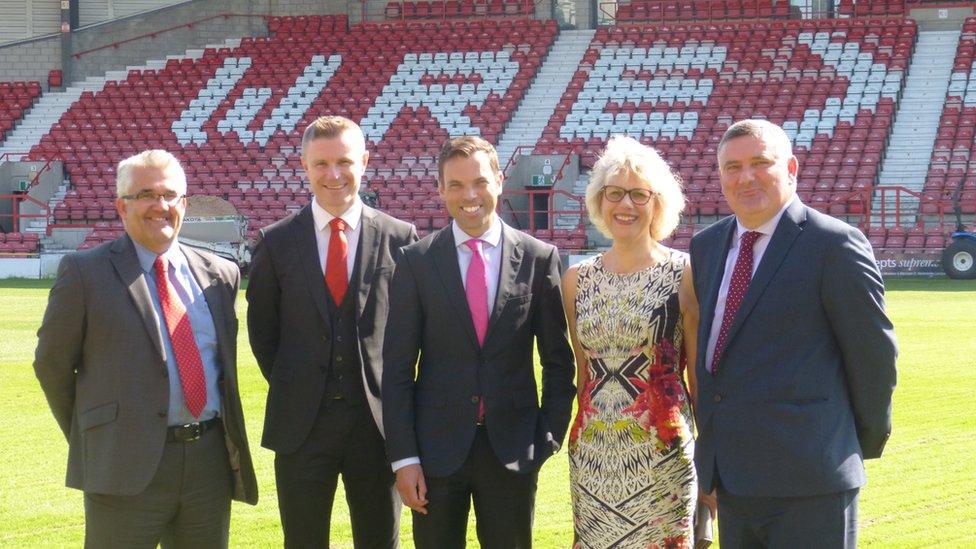 Wrexham council chief executive Ian Bancroft, Wrexham AFC director Spencer Harris, Welsh Economy Minister Ken Skates, Prof Maria Hinfelaar of Glyndwr University, and Wrexham council leader Mark Pritchard