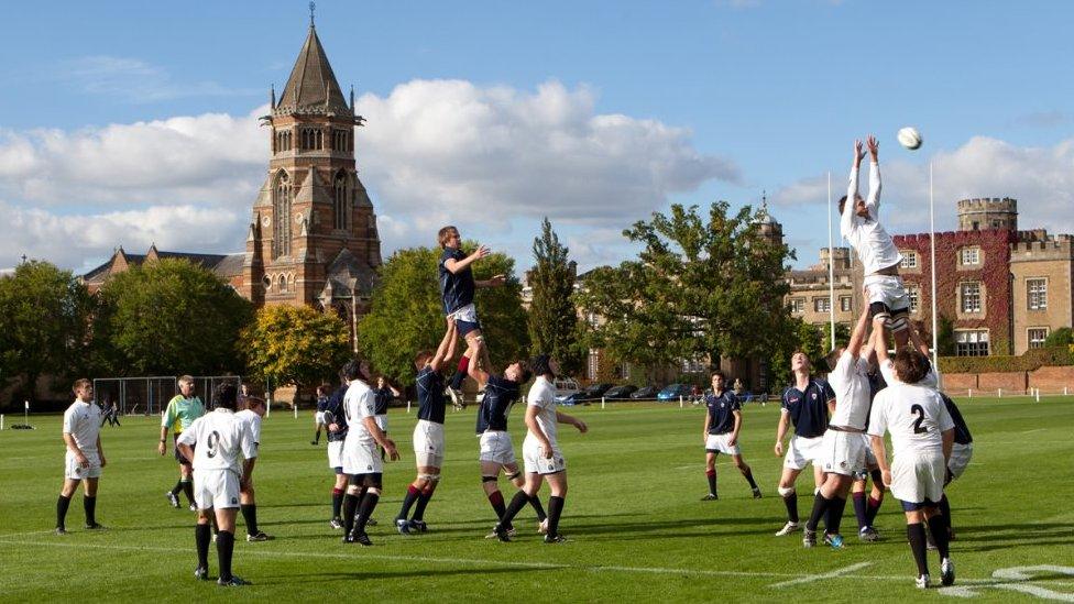 Two teams play rugby at Rugby