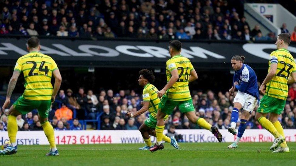 Wes Burns strikes the ball to score for Ipswich