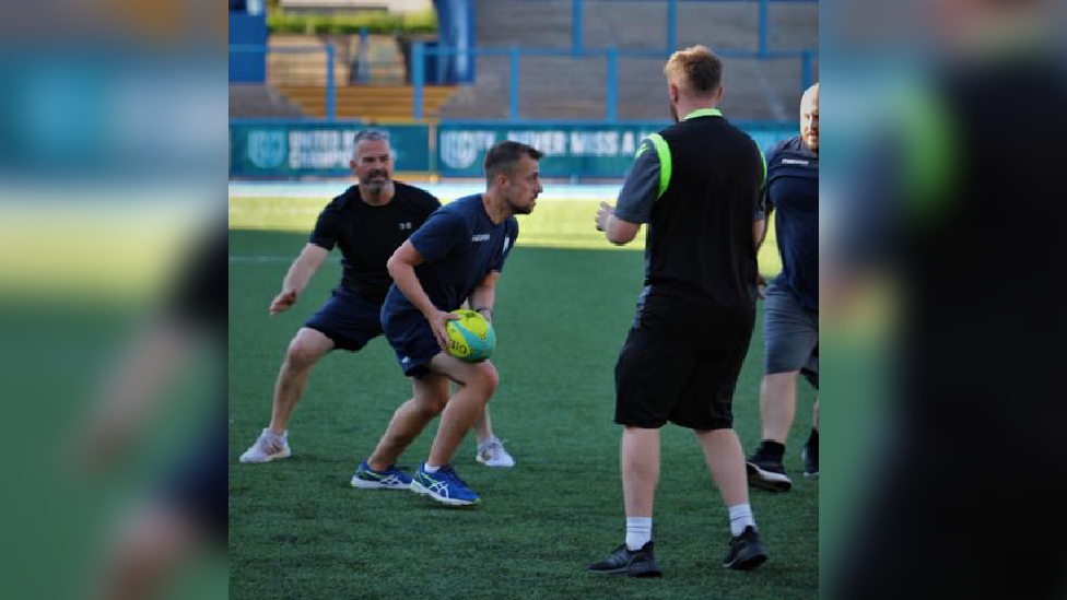 Gareth and Davies playing rugby