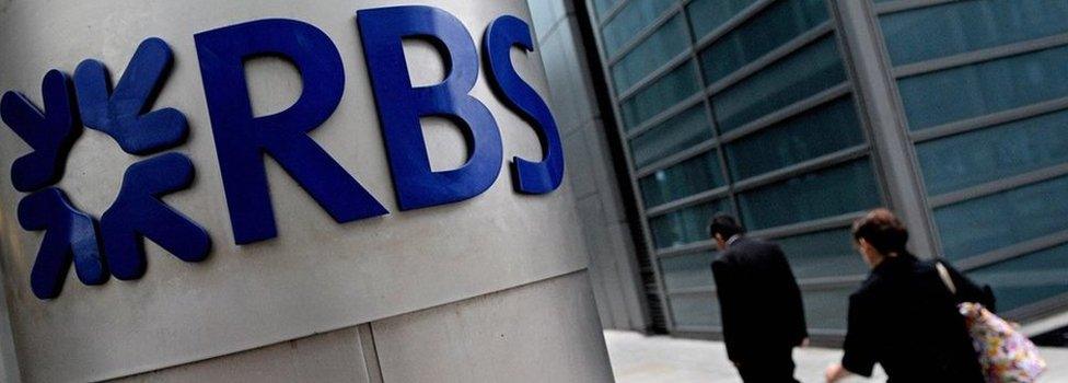 People walk past the London headquarters of the Royal Bank of Scotland