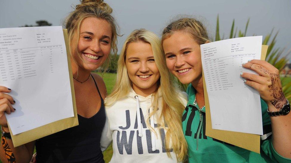 Happy students Alexandra Adams, Katie Fisher and Kathrine Hill pick up their results at Sullivan Upper