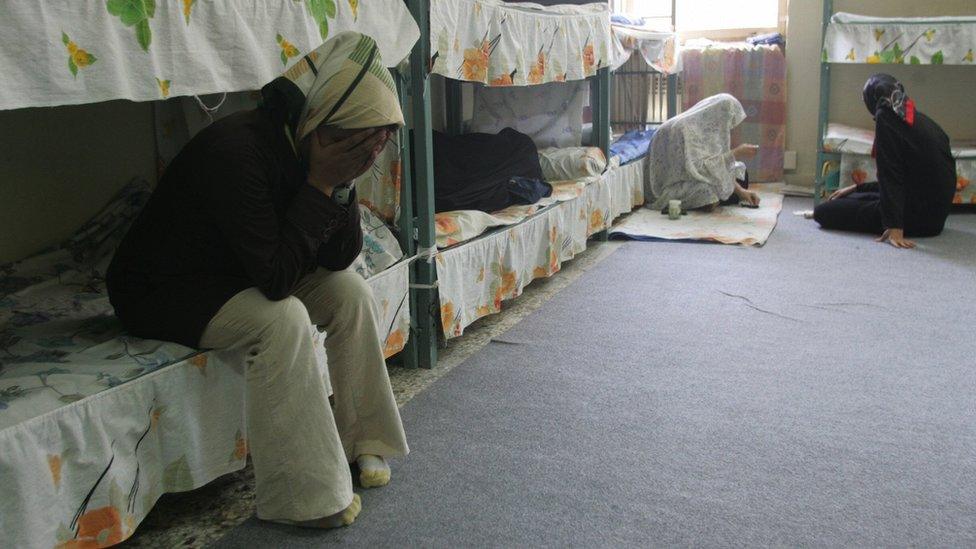 Iranian women inmates sit at their cell in the infamous Evin jail