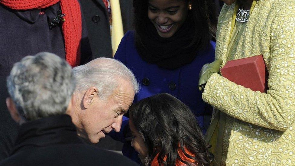 Joe Biden talks to Sasha Obama