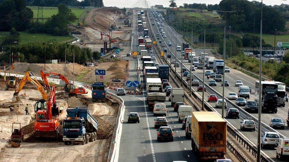 Busy motorway next to roadworks