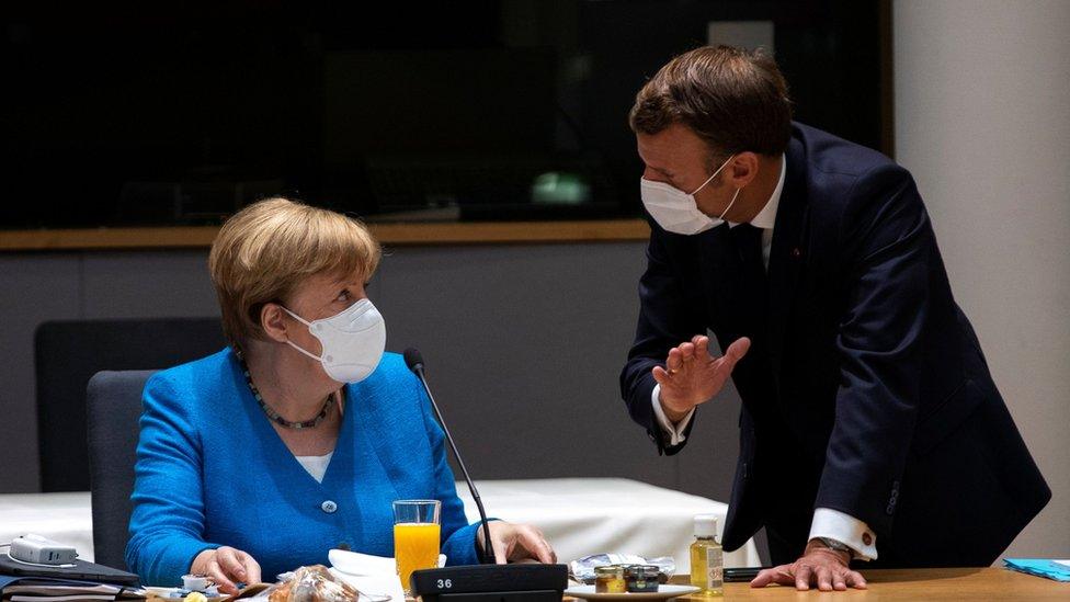 Angela Merkel and Emmanuel Macron wear masks at an EU summit in Brussels