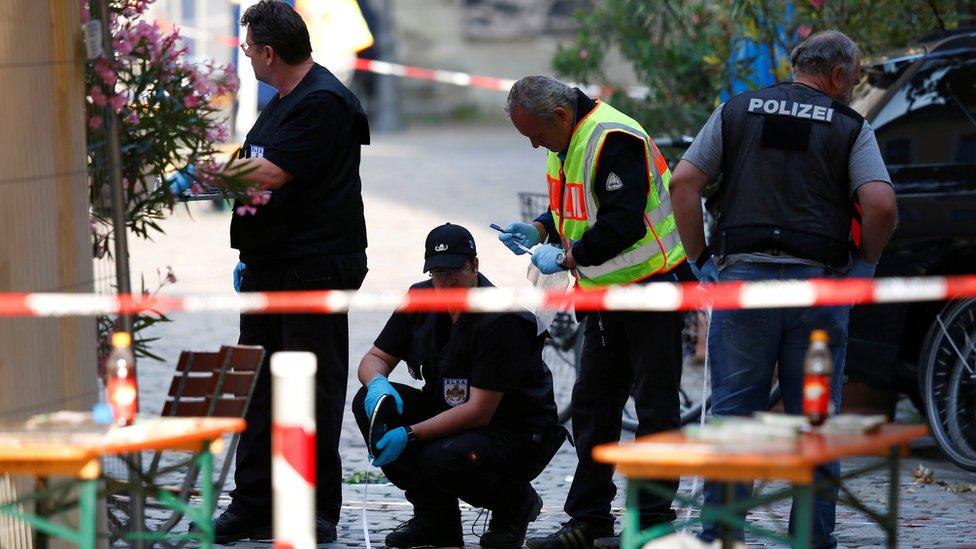 Police secure the area after an explosion in Ansbach