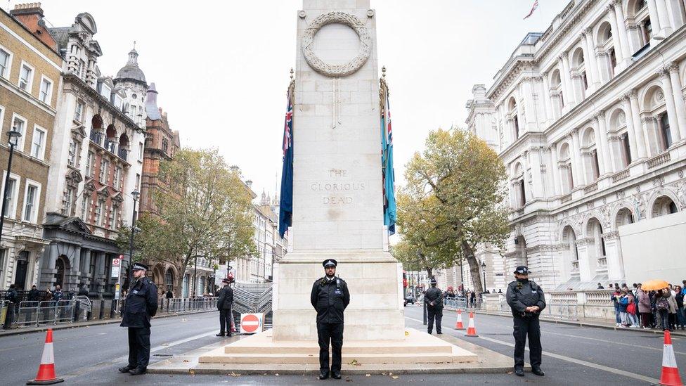 Officers from the Metropolitan Police on duty beside the Cenotaph in Whitehall, central London, ahead of marches planned for the centre of the city on Armistice Day.