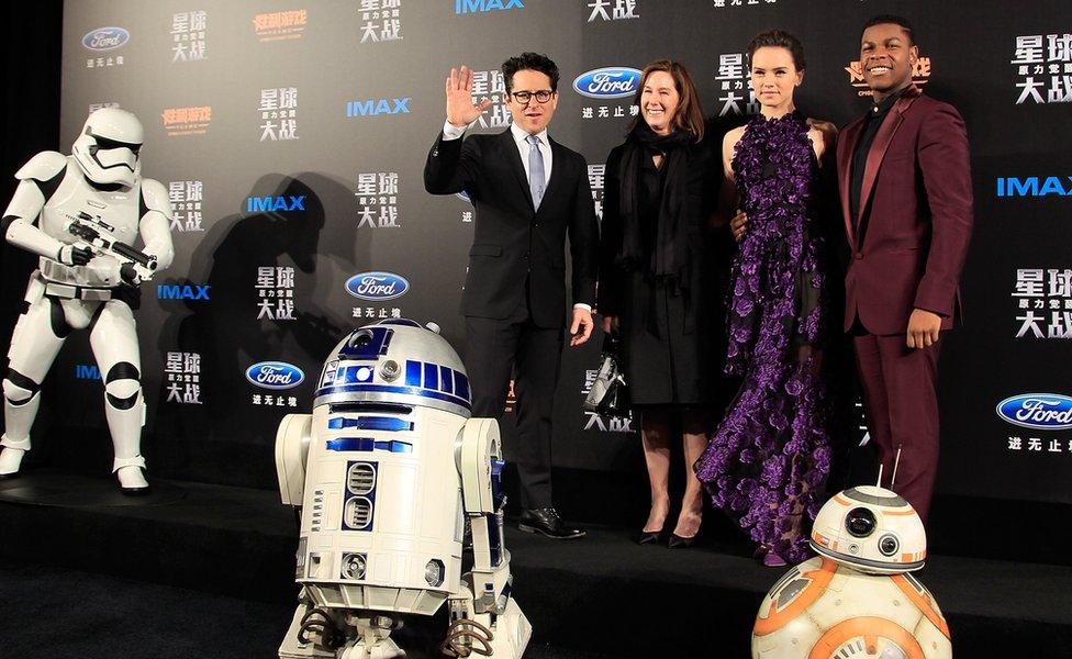 From left to right: JJ Abrams, Kathleen Kennedy, Daisy Ridley, and John Boyega at the premiere of the movie in Shanghai