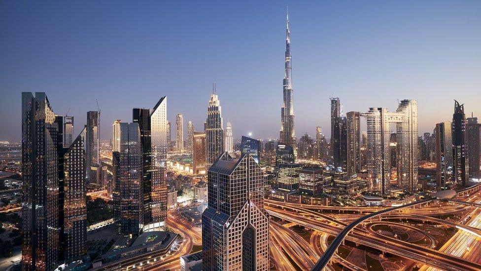 Dubai cityscape at night, an urban skyline with the Burj Khalifa