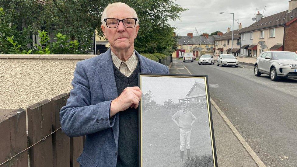 Sammy Mcdevitt holding photo f brother eamon