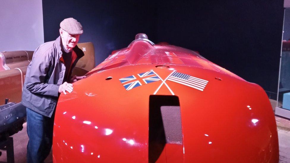 John Cooper next to a replica of the Sunbeam